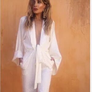 Amazing jumpsuit. New with tags. Size medium. Fits like a glove